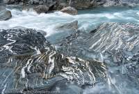 Folded quartz layers in schist, Clarke River at Marks Flat, Hooker - Landsborough Wilderness Area, Southern Alps, New Zealand.